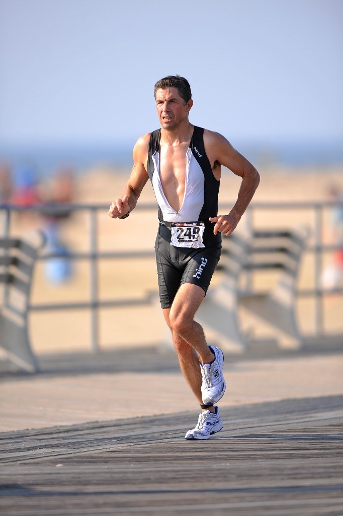 Michael racing on a boardwalk